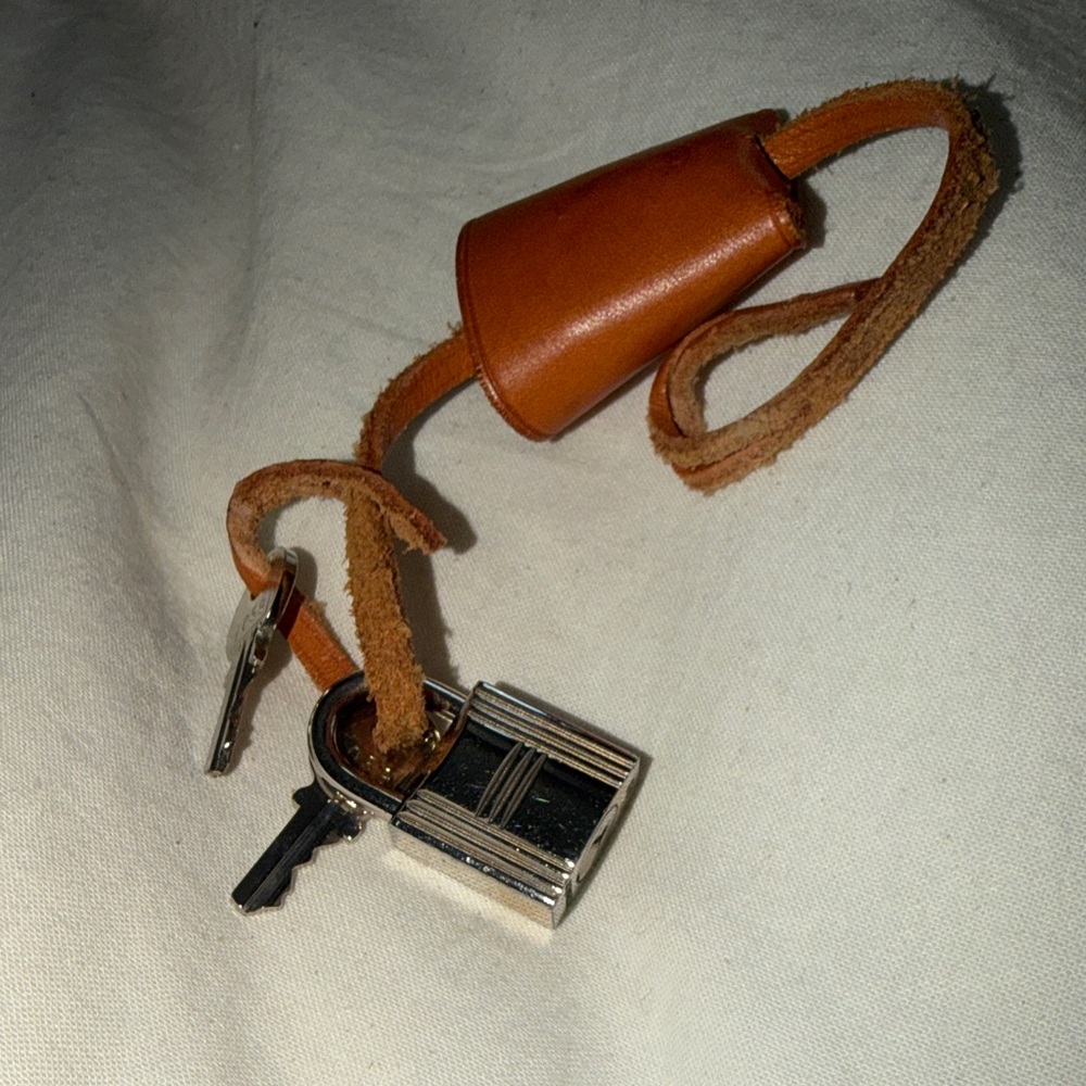 Hermes Brown Leather Keychain Strap with Silver Padlock Accent
